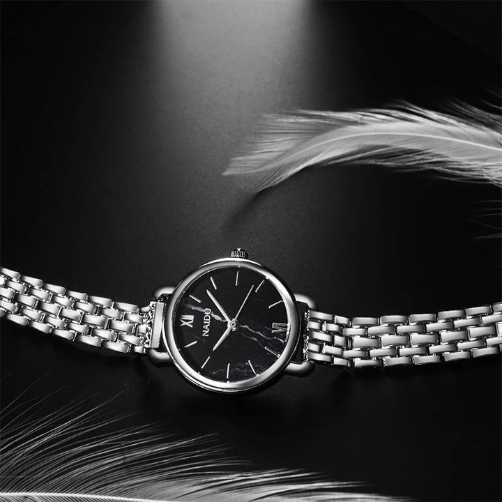 Stylish women's quartz watch with a marble dial and durable stainless steel band.