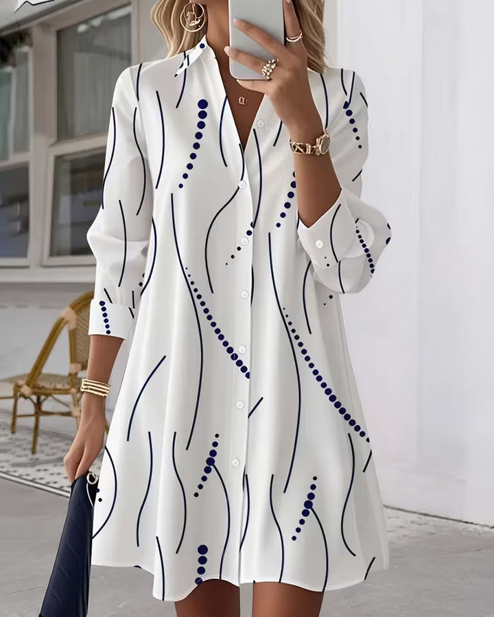 Chic women's midi dress featuring a unique wavy collar, flowy silhouette & pretty print for summer fashion.