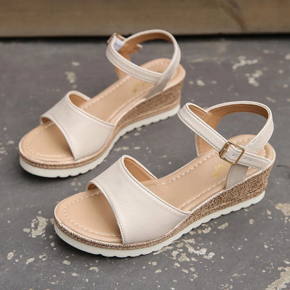 Stylish black wedge heels for women, offering effortless everyday elegance for both casual and dressy outfits.