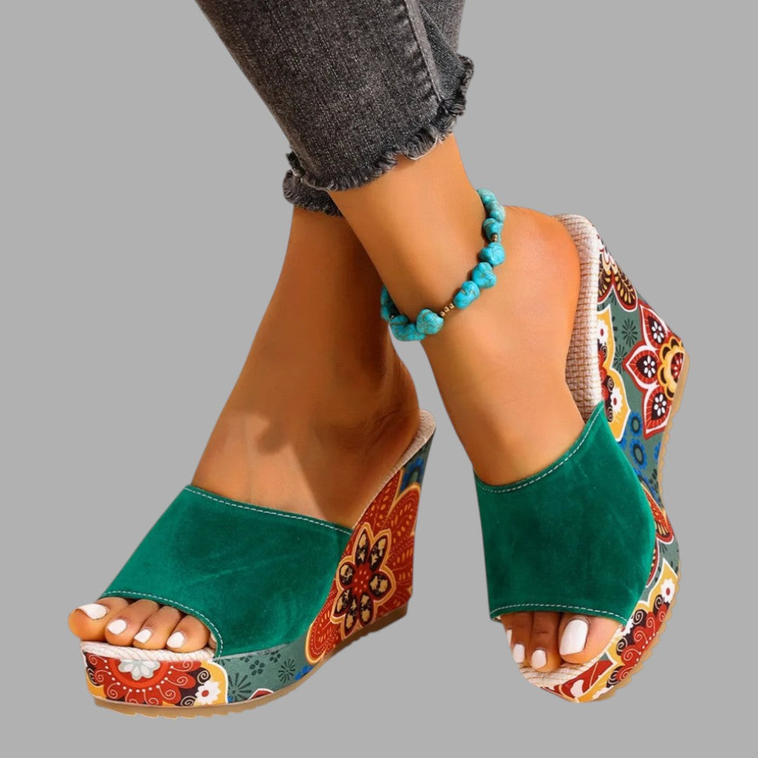 Elegant women's wedge sandals, perfect for summer occasions. Comfortable elevated style with open toe design.