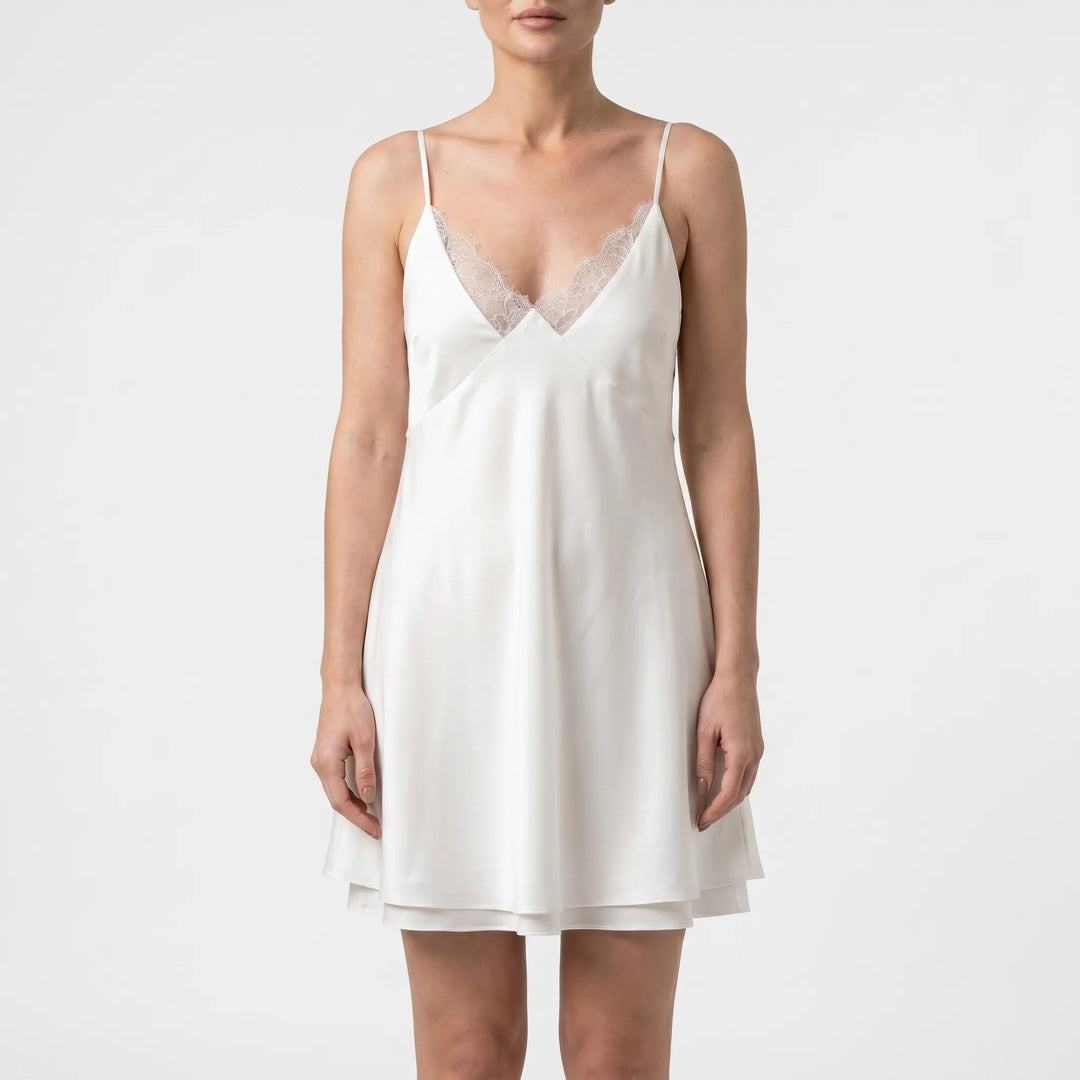 Chic women's white backless mini dress, versatile for summer nights, parties, or elegant casual occasions.
