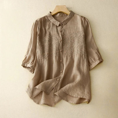 Close-up of a women's embroidered long sleeve shirt, showcasing delicate embroidery details & soft, comfortable fabric.