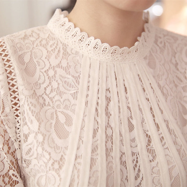 Romantic long-sleeve lace blouse for women, showcasing delicate floral patterns. A stylish addition to any fashion wardrobe.