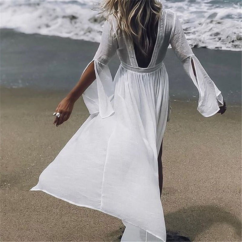 Elegant women's white open back maxi beach dress with flowy design, perfect for summer resort wear.