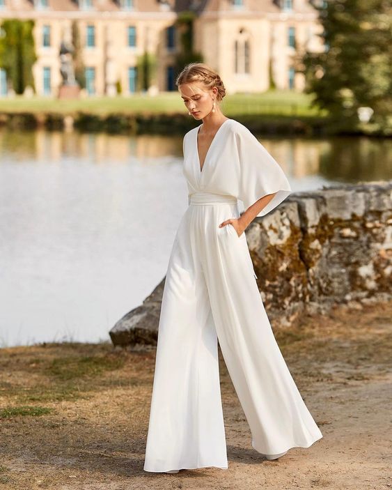 Elegant women's wide leg evening jumpsuit with button front. Perfect for formal events & parties.