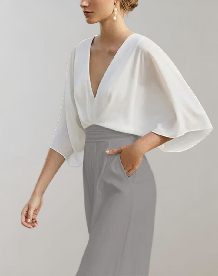 Sophisticated wide leg evening jumpsuit for women. Perfect formal party or wedding guest outfit.