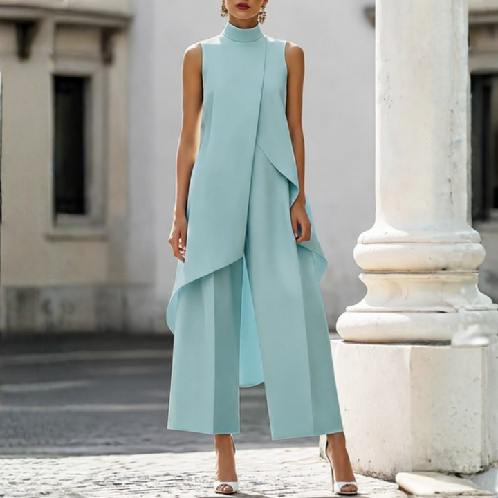 Effortless modern women's wide-leg jumpsuit. Comfortable drop waist design offers a sleek, sophisticated look.