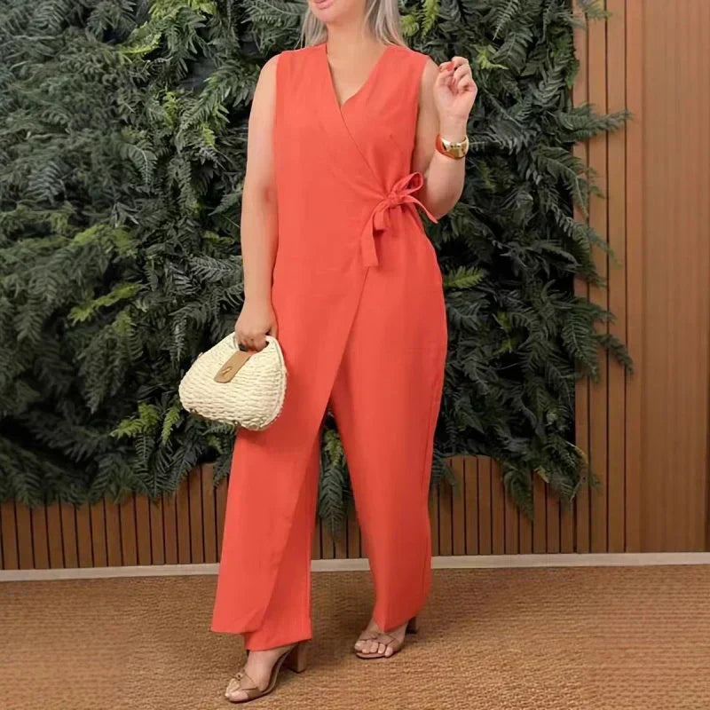 Elegant women's wide-leg jumpsuit with wrap V-neck and belted waist, perfect for versatile summer styling.