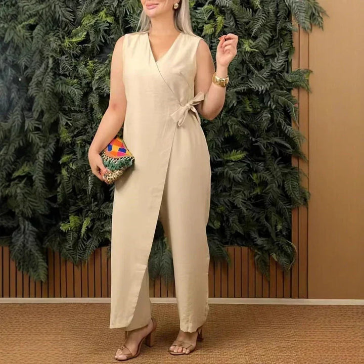 Sleeveless wide-leg jumpsuit for women, featuring a flattering wrap V-neck and a chic belt for casual elegance.