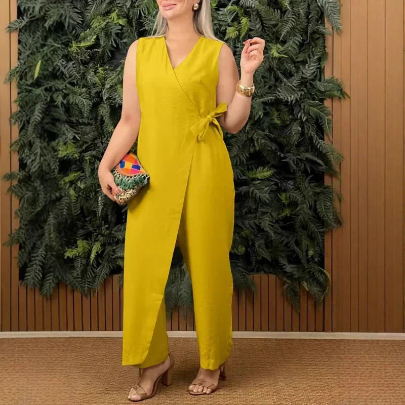 Flowy wide-leg women's jumpsuit with an elegant wrap V-neck and a cinching belt, designed for a flattering silhouette.