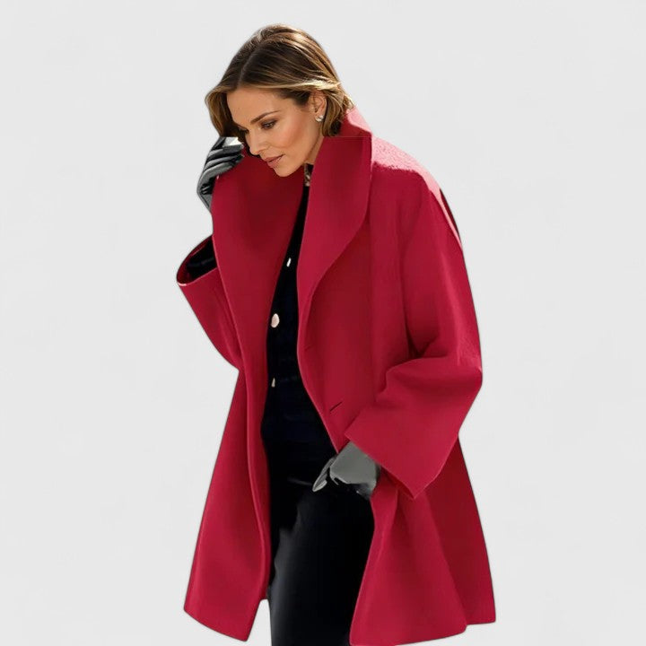 Chic women's longline coat. Elegant winter fashion for versatile comfort & seasonal warmth.