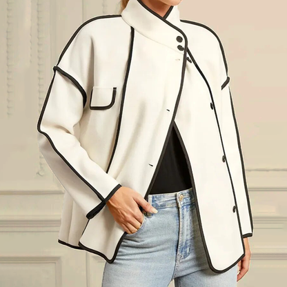 Insulated women's winter jacket for warmth. Elegant design with contrast piping, perfect for cold weather fashion.