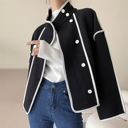 Sophisticated women's insulated winter jacket, elegant with contrast piping. Perfect chic apparel for cold weather.