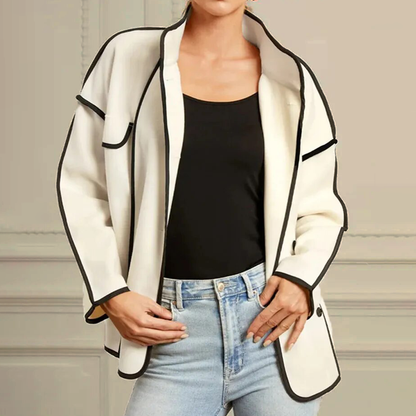 Stylish women's insulated jacket, elegant piped design. Optimal warmth for winter fashion and sophisticated outerwear.