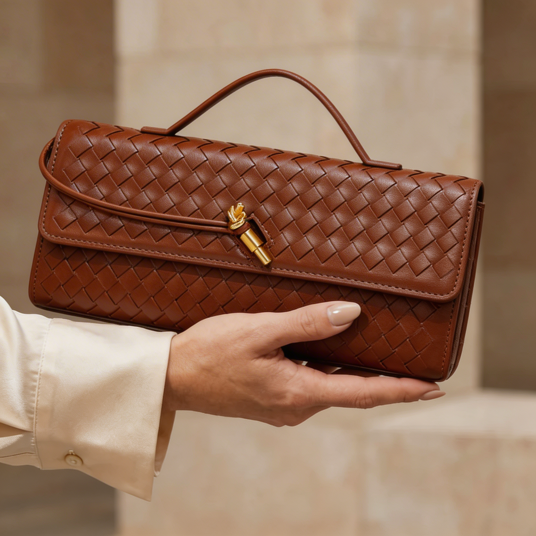 Women's luxury top-handle clutch handbag, crafted from beautiful woven leather for an elegant accessory.