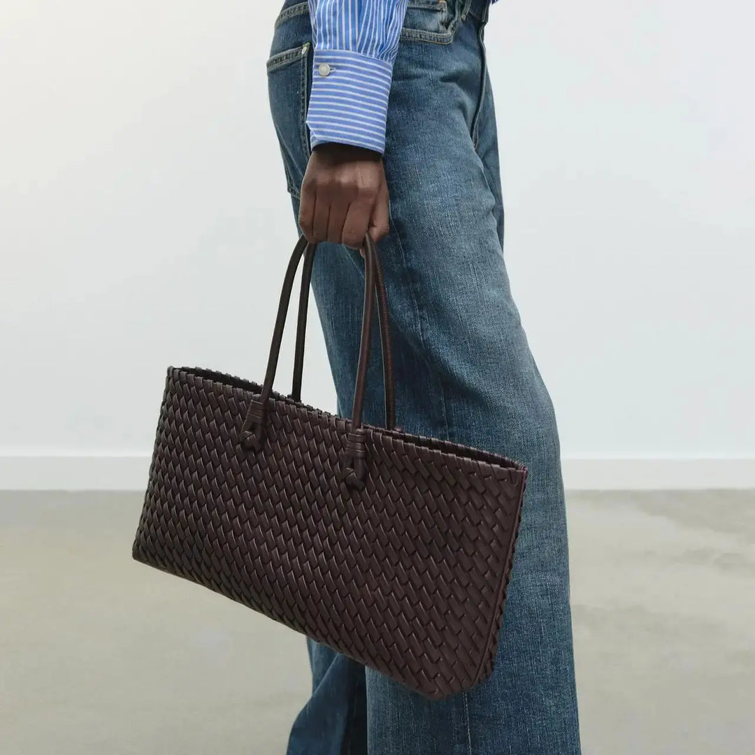 Versatile women's woven shoulder bag, a chic and elegant everyday tote for organized carrying.