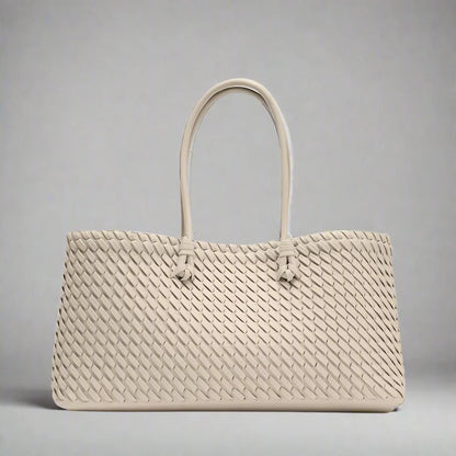 Sophisticated women's woven shoulder bag, an elegant accessory for a polished and chic ensemble.