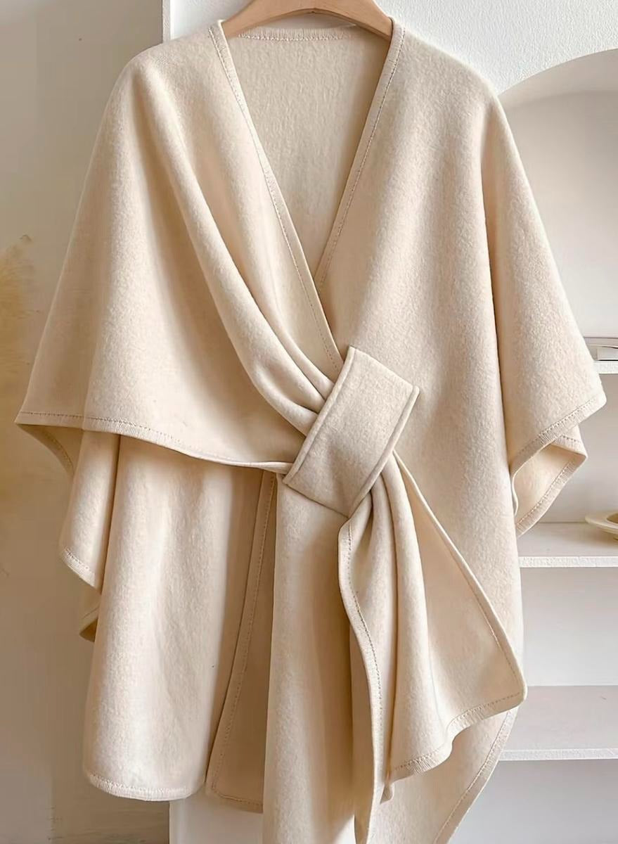 Versatile women's elegant blouse featuring a unique wrap and cape style, perfect for a chic, modern layered look.