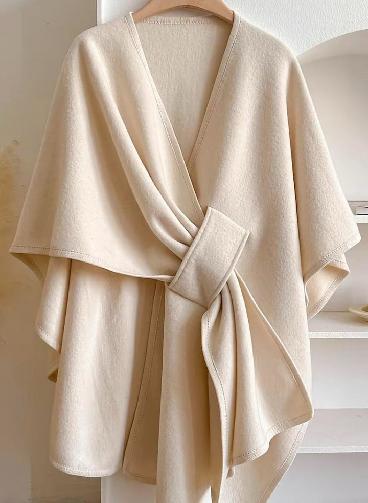 Versatile women's elegant blouse featuring a unique wrap and cape style, perfect for a chic, modern layered look.