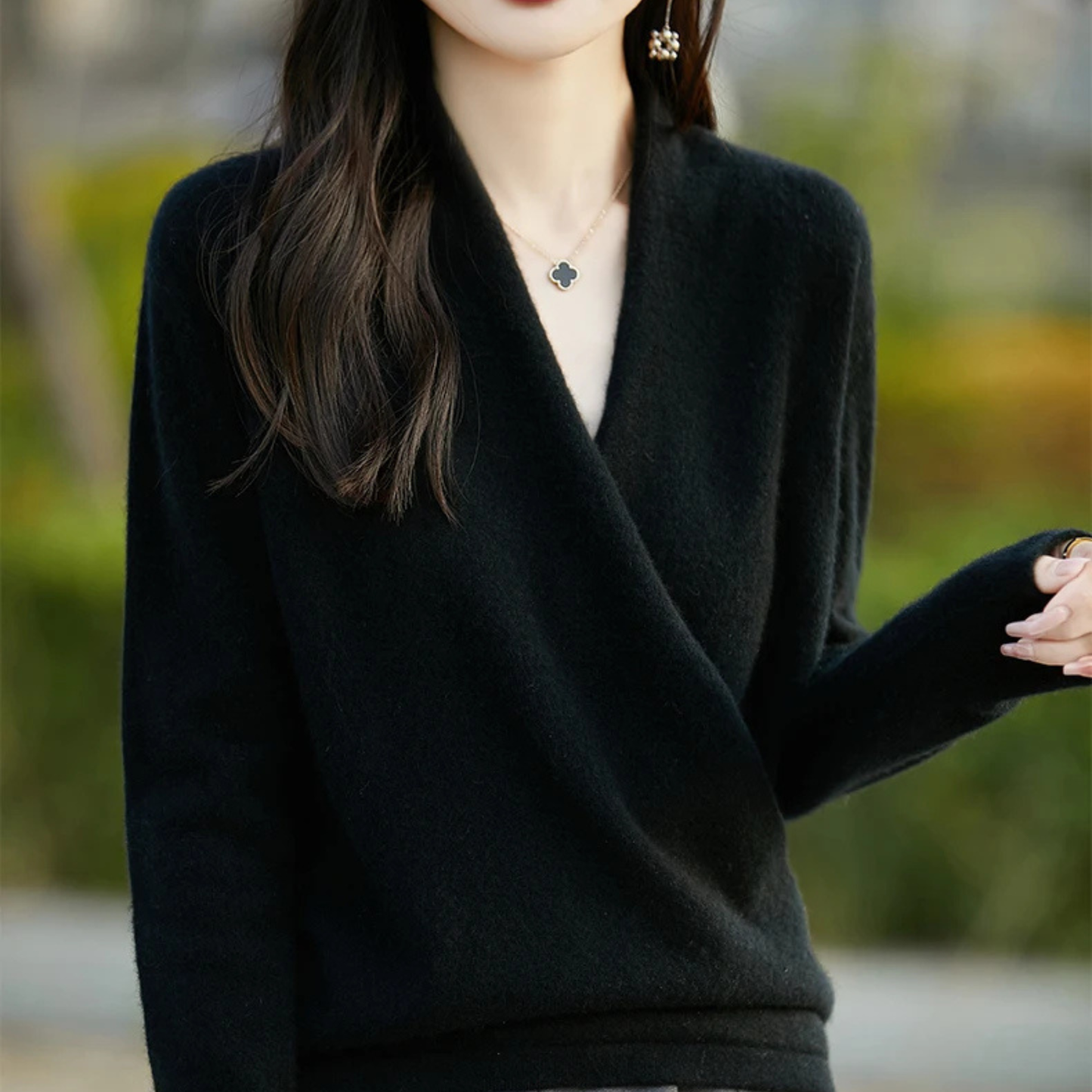 Fashionable women's wrap sweater, V-neck, for elegant modern fall & winter apparel.