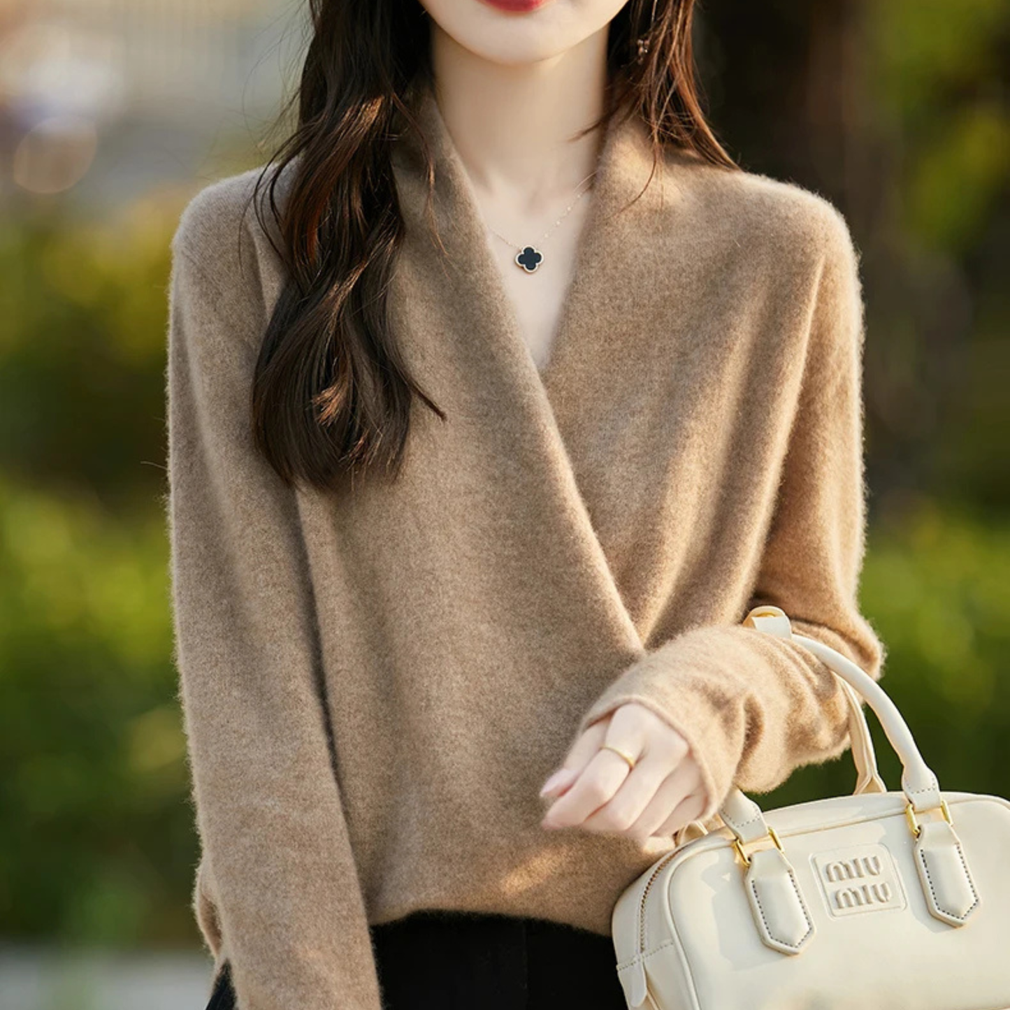 Elegant women's wrap V-neck sweater, perfect layering piece for modern fall & winter fashion.