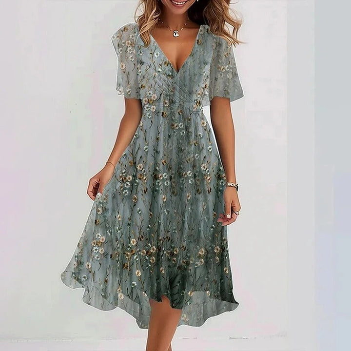 Women's elegant V-neck flutter sleeve wrap midi dress, a flowing and romantic design for summer parties.