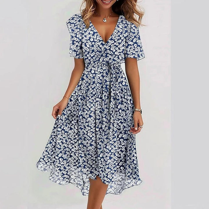 Casual yet elegant women's V-neck wrap dress with flutter sleeves & ruffle hem, ideal for summer comfort.
