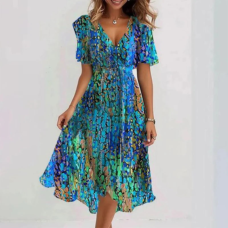 Lightweight women's floral midi wrap dress with V-neck & flutter sleeves, perfect for a casual summer feel.