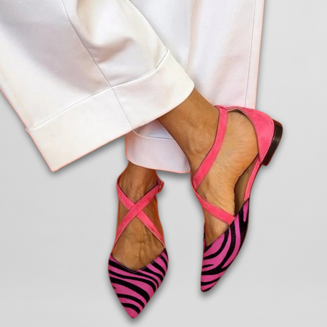 Comfortable women's zebra print pointed toe ballet flats with strap, versatile for casual or dressy looks.