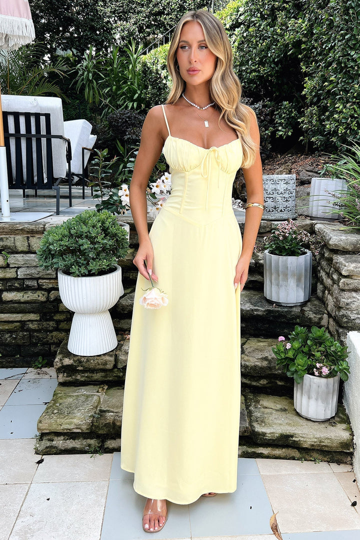 Stylish women's yellow summer maxi dress, featuring a sweetheart neckline and corset design for formal events.