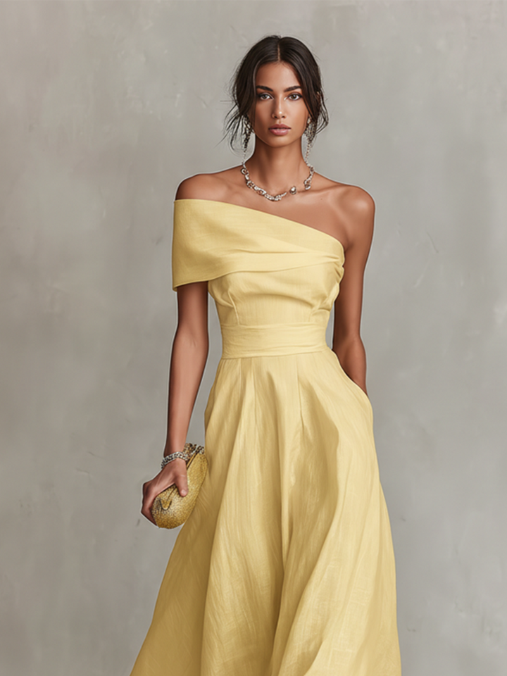 Stylish women's yellow A-line midi dress with one shoulder and ruched details, great for evening events.