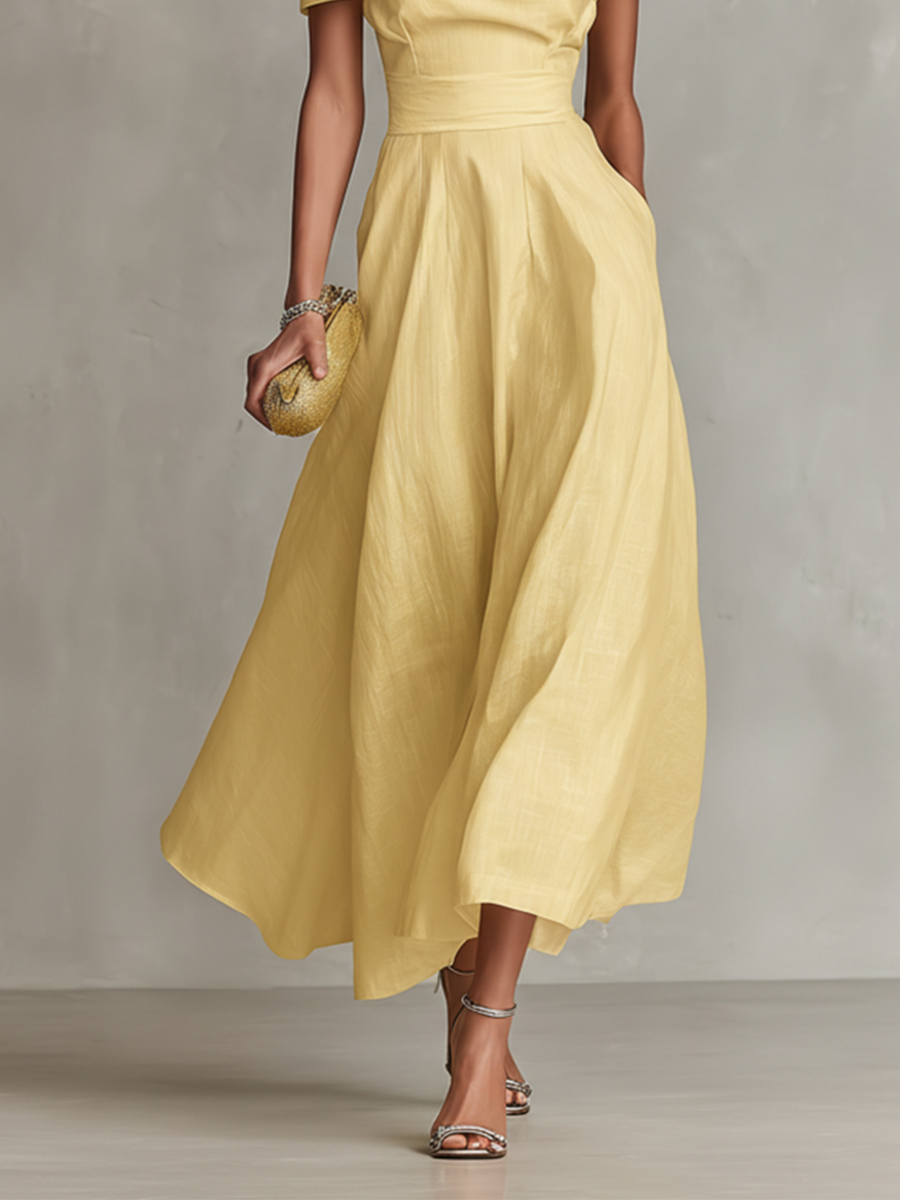 Beautiful yellow midi wedding guest dress, featuring an elegant one-shoulder design and ruched A-line silhouette.