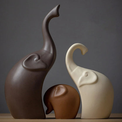 Elephant family trio ceramic statues, modern home decor set for living room table. Minimalist decorative figurines.