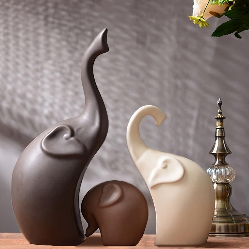 Modern ceramic elephant family statues, minimalist home decor figurines for shelves or tables. Elegant animal trio.