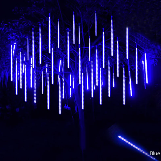 Enchanting LED snowfall projector creating a winter wonderland scene for holiday parties & outdoor decor.
