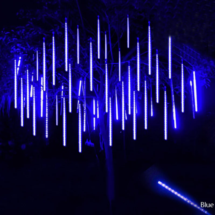 Enchanting LED snowfall projector creating a winter wonderland scene for holiday parties & outdoor decor.