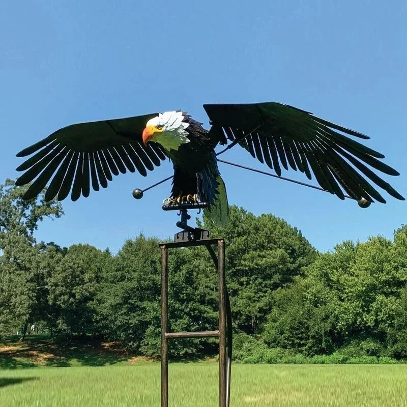 Enchanting metal bird wind spinner for garden decor, kinetic outdoor yard art sculpture.