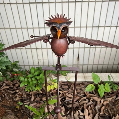 Decorative bird wind spinner, metal wildlife garden art, enchanting outdoor sculpture for yard patio.