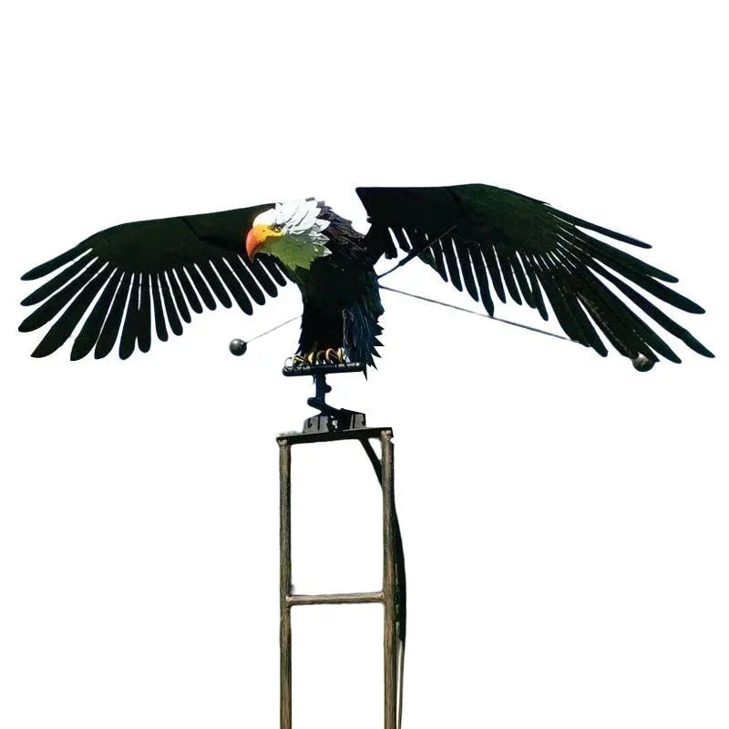 Weather-resistant bird wind spinner, durable metal outdoor garden decor, kinetic art for any yard.