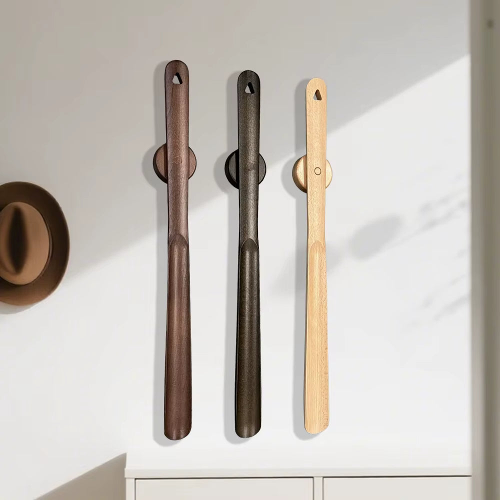 Ergonomic beech wood shoehorn with magnetic base for easy, convenient footwear access.