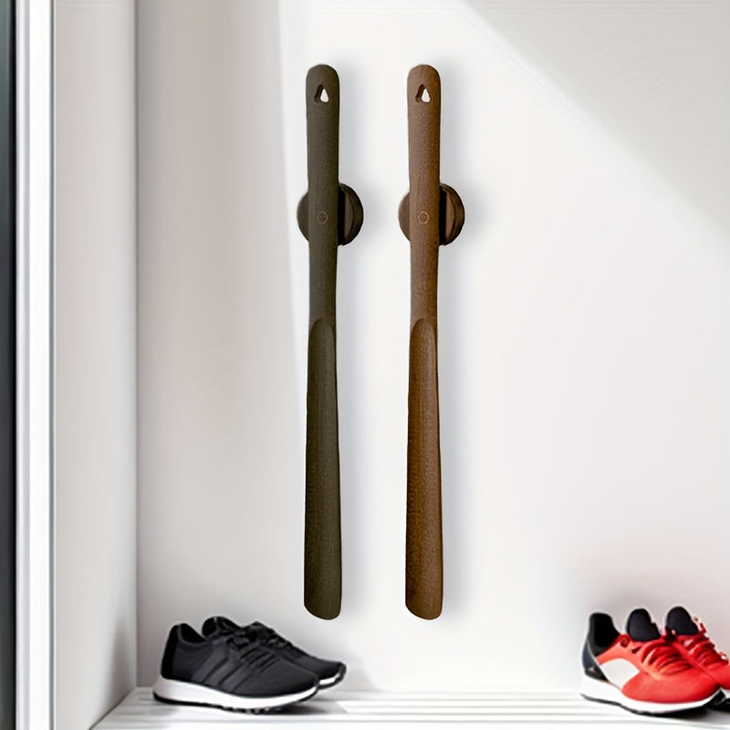 Long wooden magnetic shoehorn for easy on/off shoes, an ergonomic footwear aid.