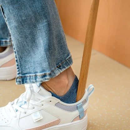 Unisex long ergonomic shoehorn in smooth beech wood, magnetic for simple storage & easy footwear access.