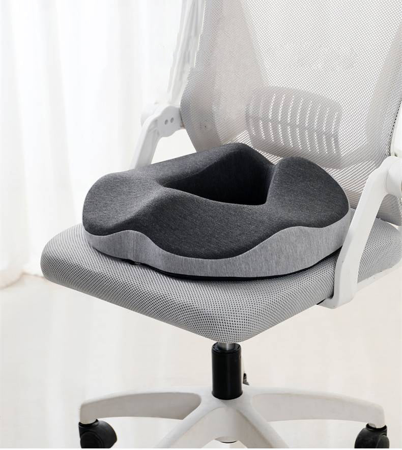 Ergonomic hemorrhoid donut pillow for ultimate pain relief & support. Memory foam seat cushion for office & travel.