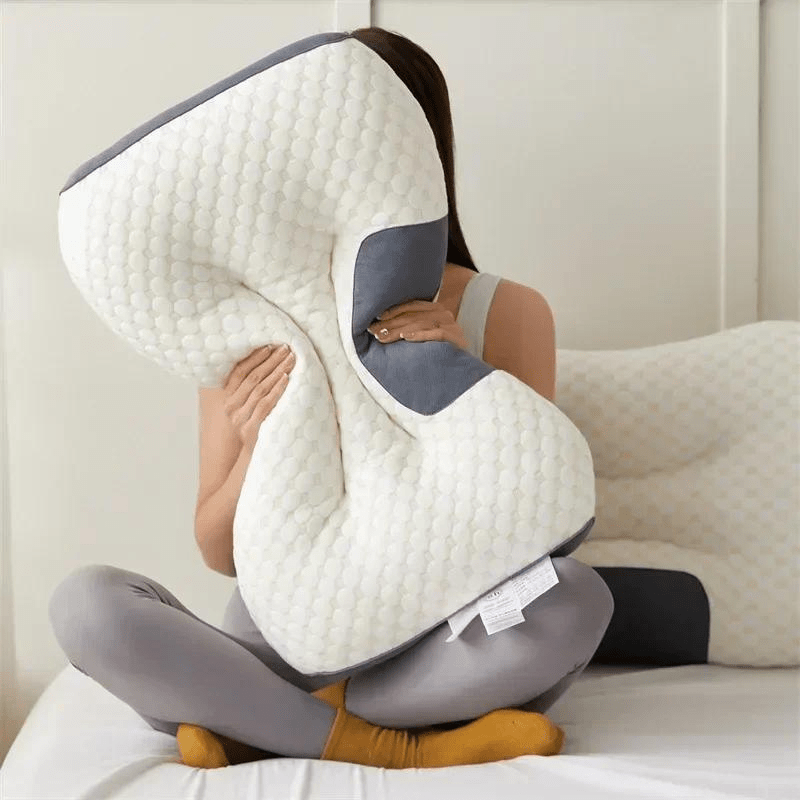 Ergonomic back support pillow, ideal for lumbar pain relief & comfortable sleep position.