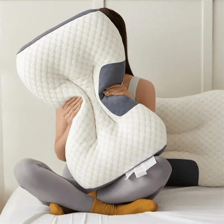 Ergonomic back support pillow, ideal for lumbar pain relief & comfortable sleep position.