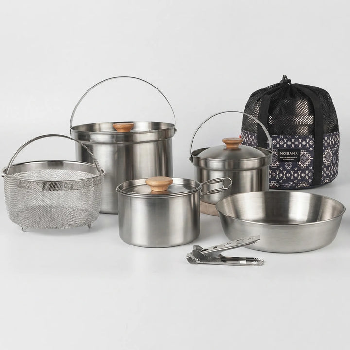 Complete family camping cookware set, compact pots & pans for outdoor adventure cooking.