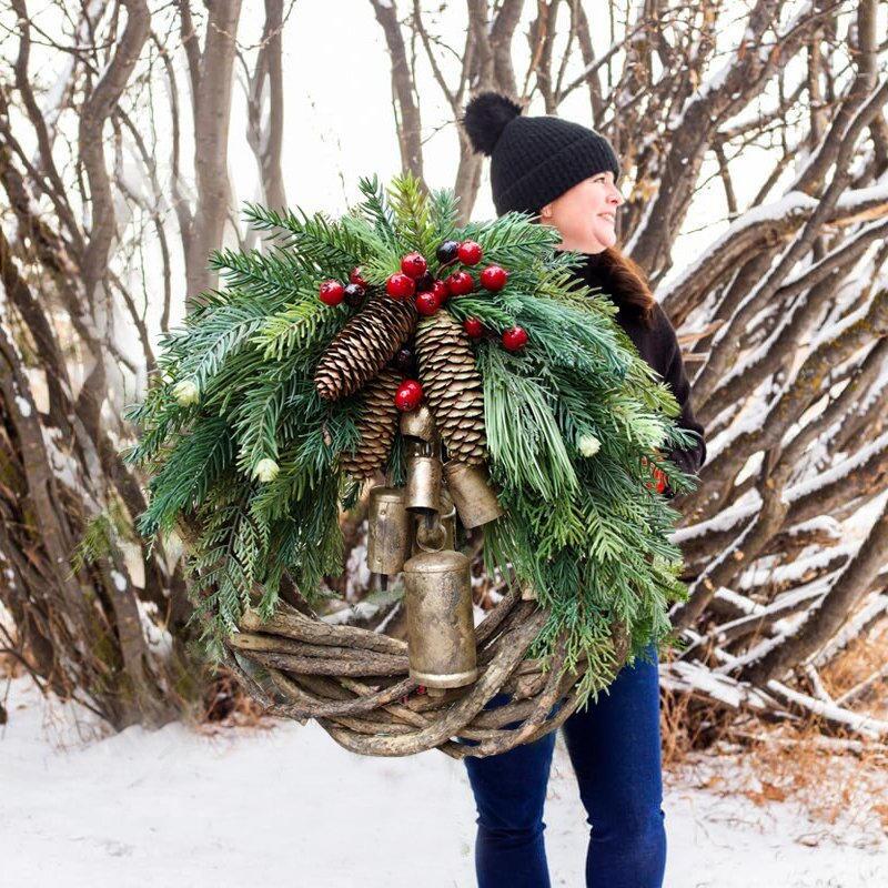 Farmhouse Christmas wreath, rustic boho holiday door decor with winter greens and festive accents, perfect for seasonal charm.