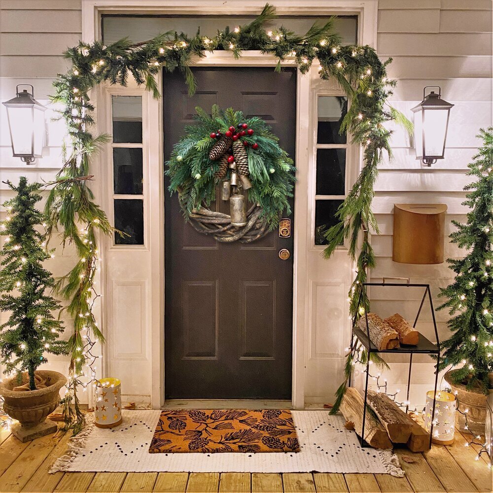 Rustic boho style Christmas wreath, a charming farmhouse holiday door decoration with artificial winter greens & festive details.