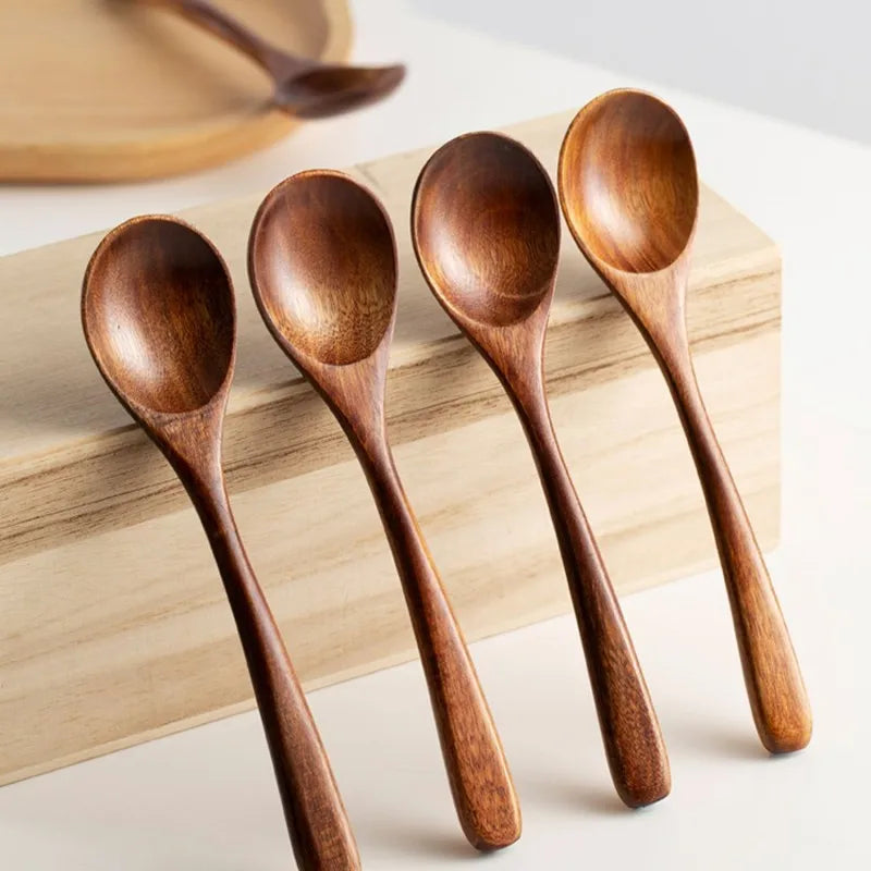 Versatile wooden spoon set for all kitchen tasks. Includes stirring, serving, & cooking tools in natural wood.