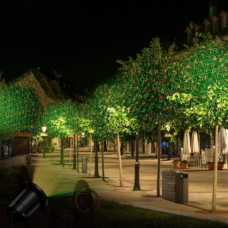 Dynamic outdoor laser light projector creating a festive party display; ideal for home & garden illumination.